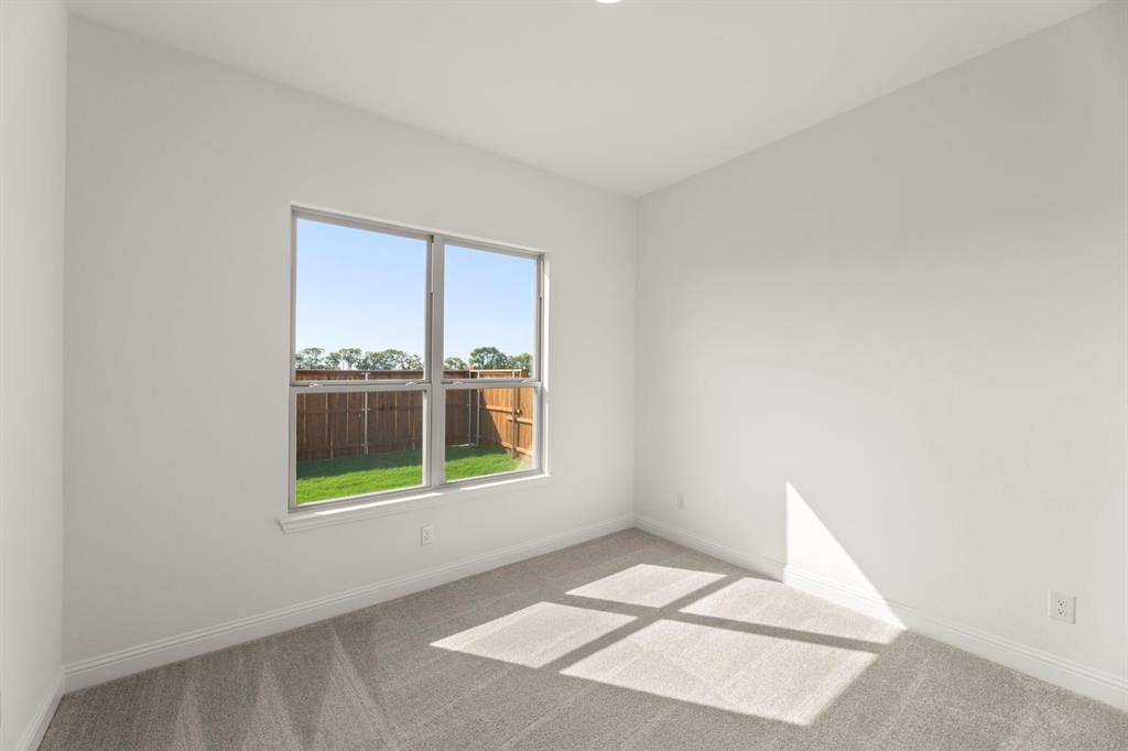 1442 Canadian Lane Van Alstyne, TX 75495 - Photo 23 of 27 a view of an empty room with a window