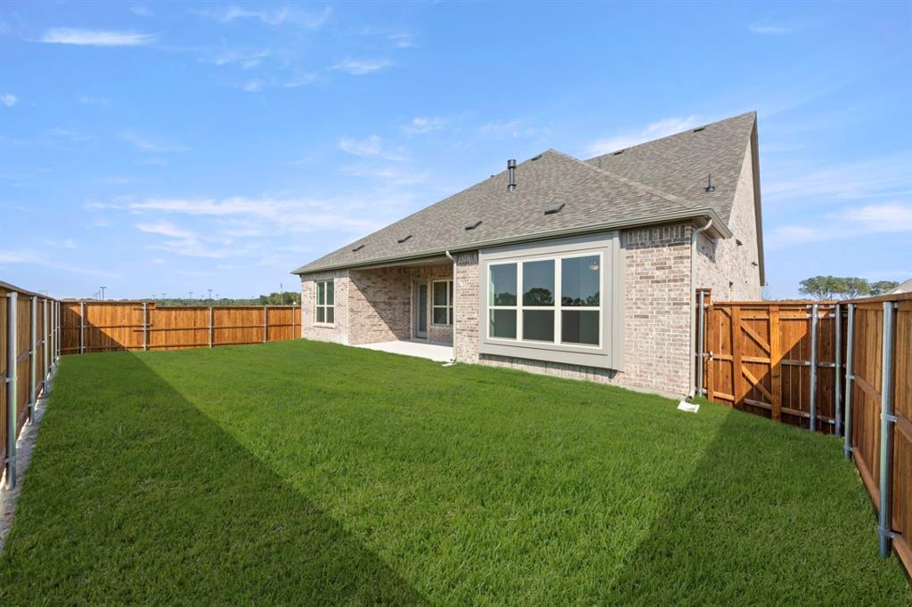 1442 Canadian Lane Van Alstyne, TX 75495 - Photo 26 of 27 a view of a house with a yard and sitting area