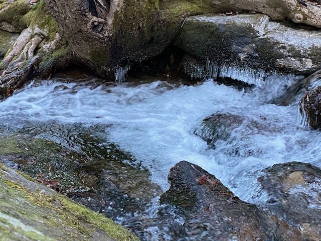 401 Rocky Bottom Road Sunset, SC 29685 - Photo 39 of 40 A tranquil creek flows through a rocky landscape, creating a serene natural setting.