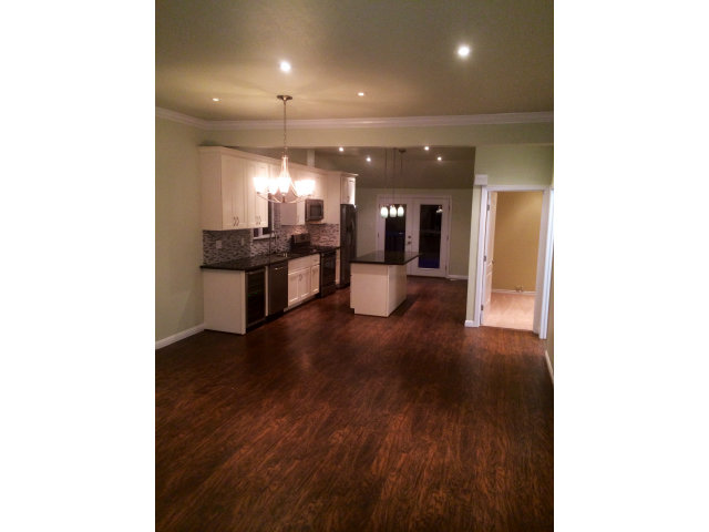 369 Pacific Avenue Pacifica, CA 94044 - Photo 2 of 6 a open kitchen with a sink and breakfast area