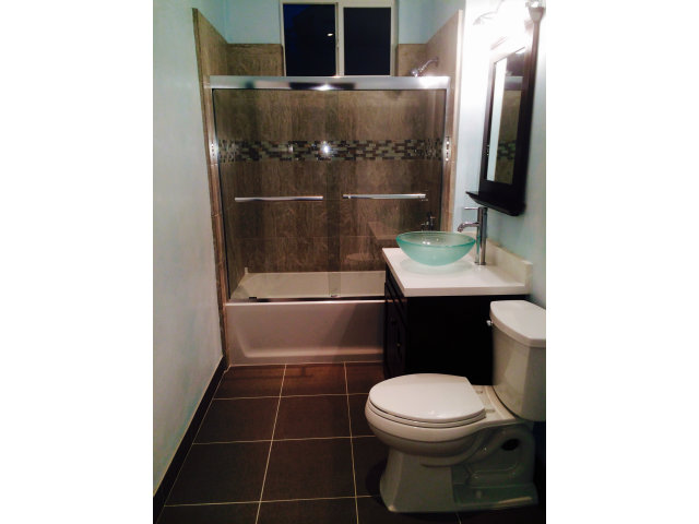 369 Pacific Avenue Pacifica, CA 94044 - Photo 4 of 6 a bathroom with a sink a toilet and a mirror