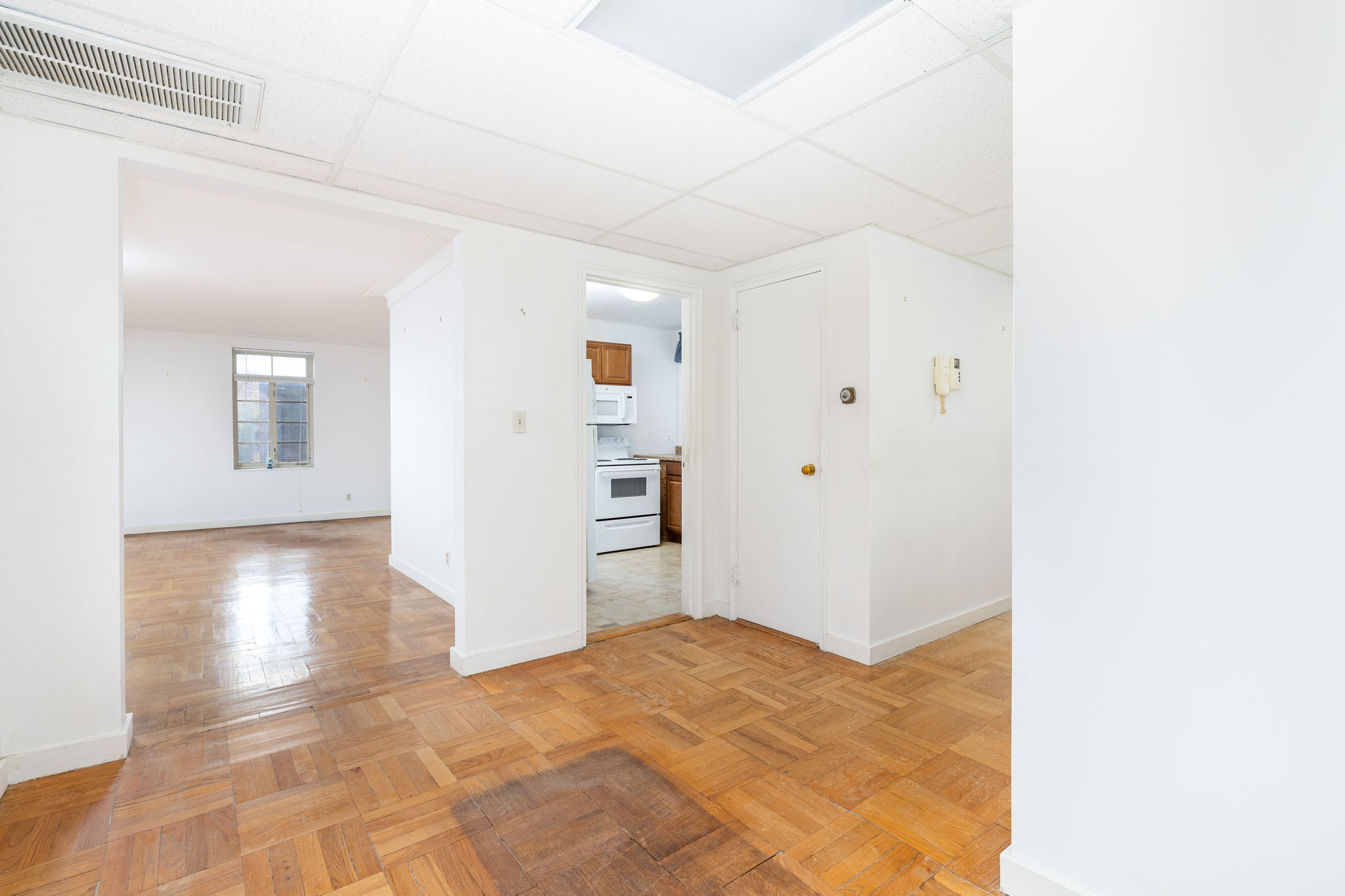 869 Farmington Avenue, Unit 305 West Hartford, CT 06119 - Photo 21 of 30 a view of a bedroom with wooden floor and windows