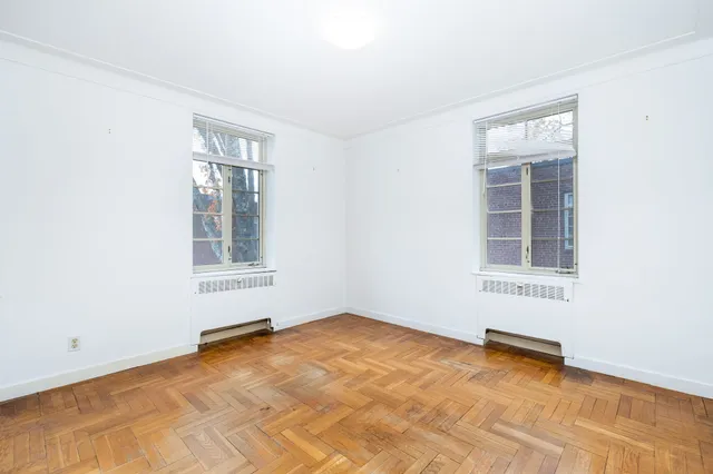 an empty room with windows