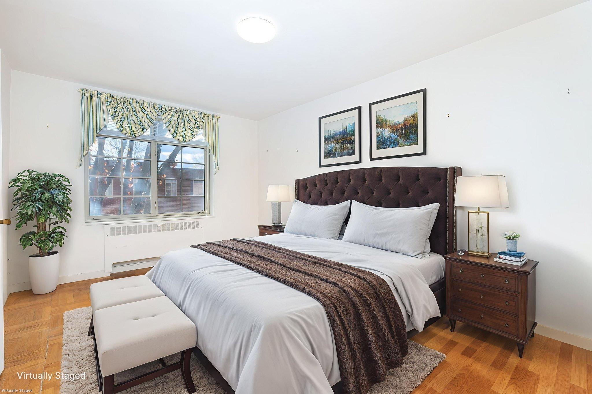 869 Farmington Avenue, Unit 305 West Hartford, CT 06119 - Photo 10 of 30 a bedroom with a large bed and a window