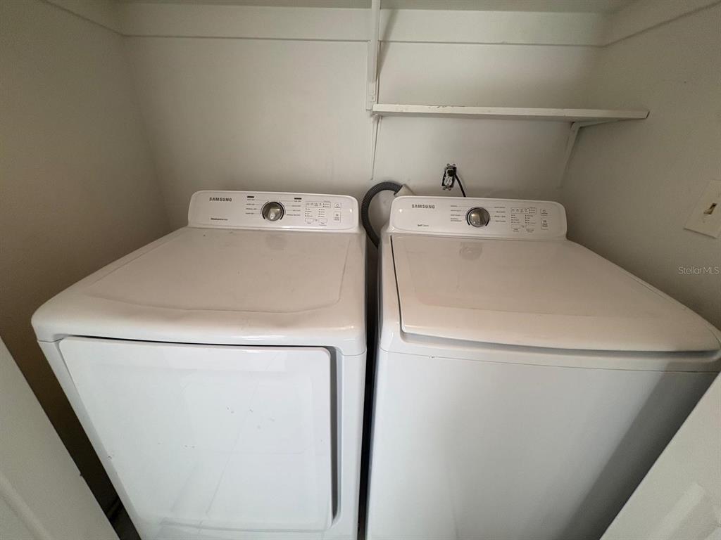 4033 Henley Road, Unit 1707 Orlando, FL 32839 - Photo 58 of 66 a utility room with dryer and washer