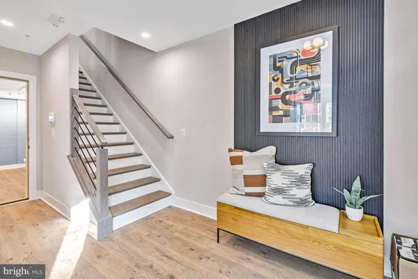 a bathroom with a sink and mirror with toilet
