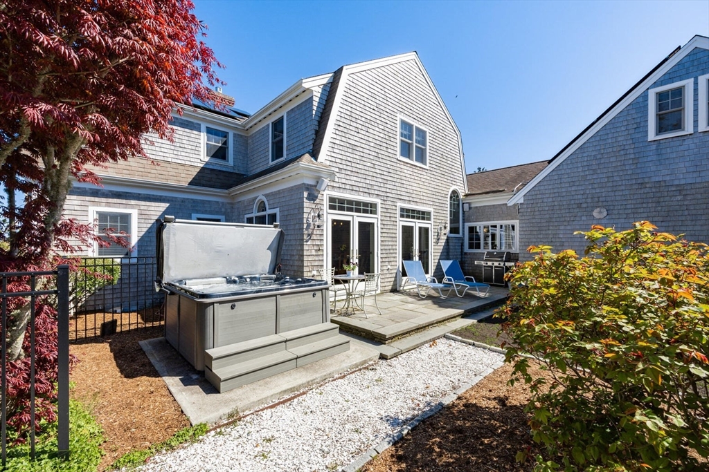 55 Cove Road Eastham, MA 02642 - Photo 11 of 42 a view of house with yard outdoor seating and barbeque oven