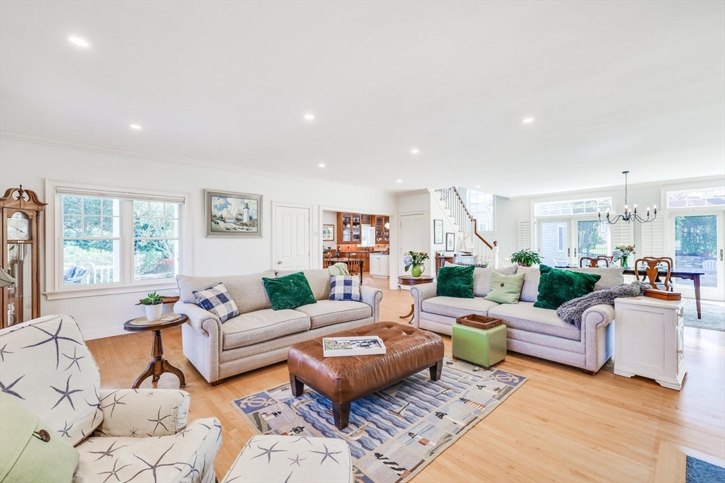 55 Cove Road Eastham, MA 02642 - Photo 14 of 42 a living room with furniture and a large window