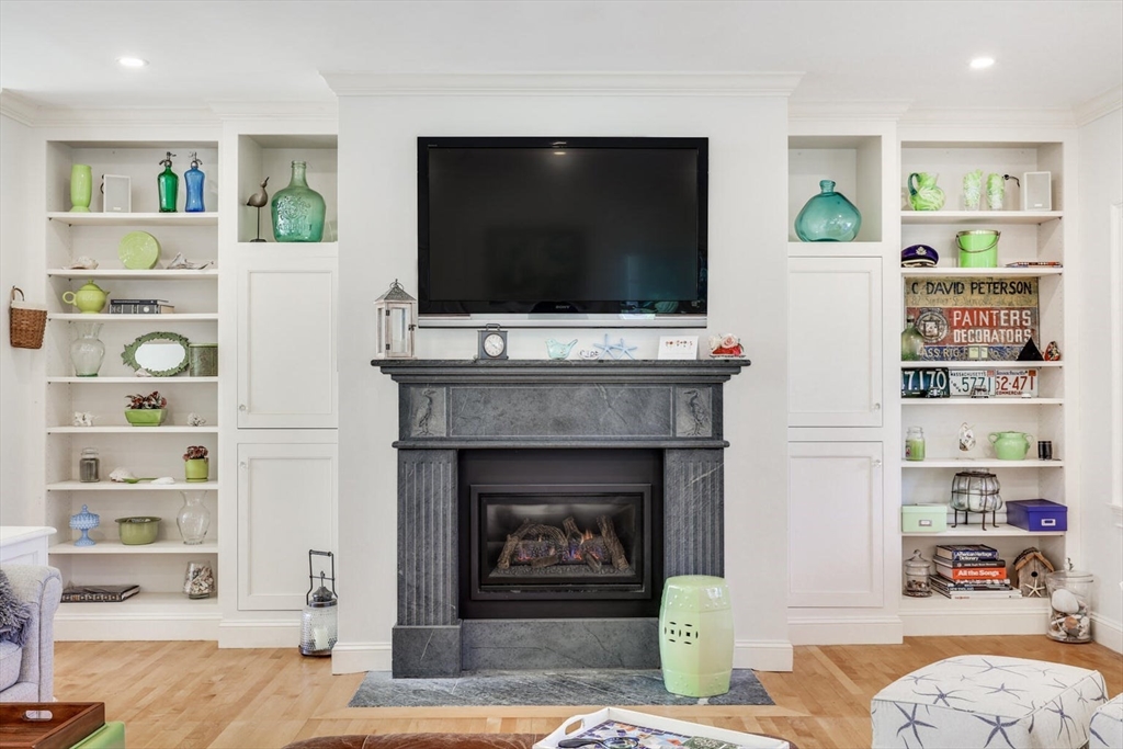 55 Cove Road Eastham, MA 02642 - Photo 16 of 42 a living room with furniture and a flat screen tv