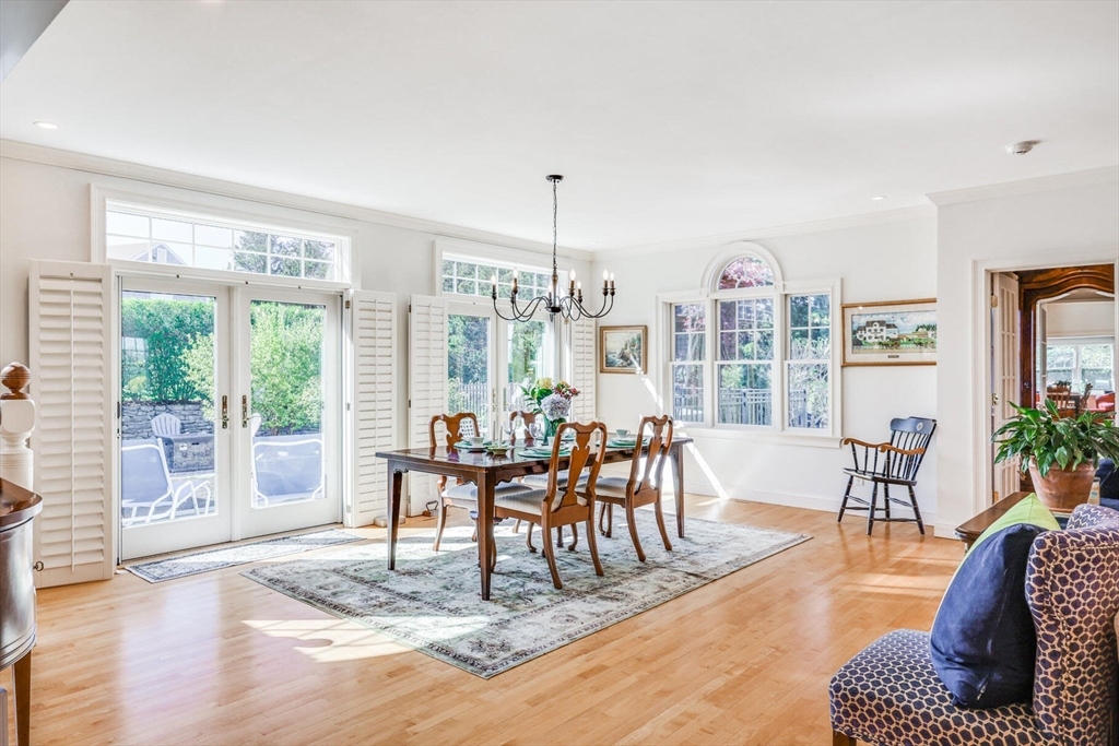 55 Cove Road Eastham, MA 02642 - Photo 17 of 42 a living room with furniture a flat screen tv and a large window