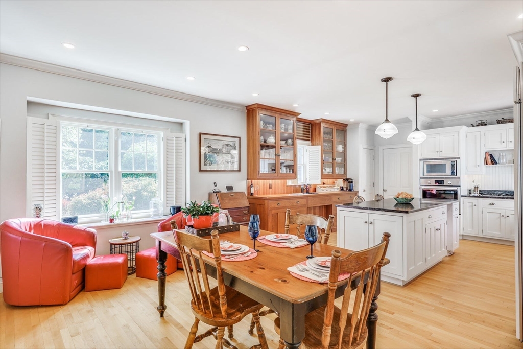 55 Cove Road Eastham, MA 02642 - Photo 18 of 42 a view of a dining room with furniture window and wooden floor