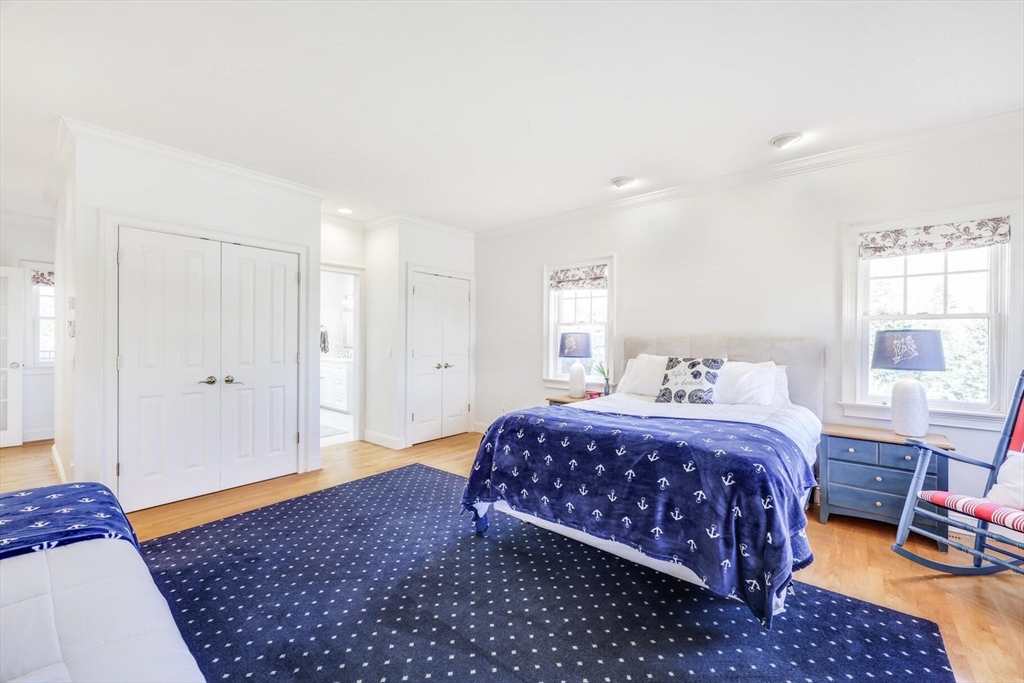 55 Cove Road Eastham, MA 02642 - Photo 24 of 42 a bedroom with a large bed and a window