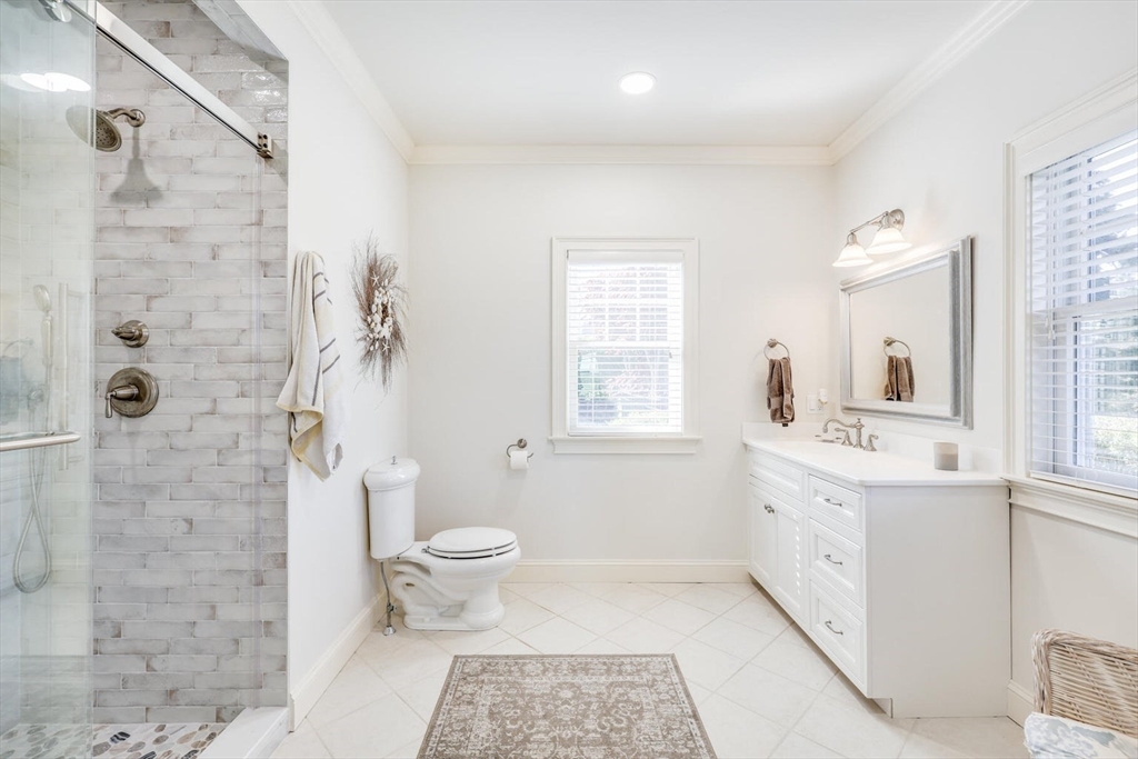 55 Cove Road Eastham, MA 02642 - Photo 25 of 42 a bathroom with a sink toilet and shower
