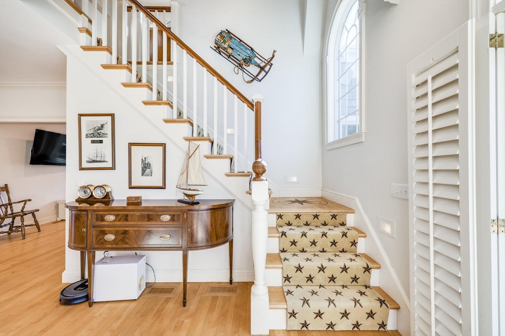 55 Cove Road Eastham, MA 02642 - Photo 27 of 42 a living room with furniture and a flat screen tv