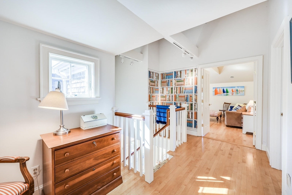 55 Cove Road Eastham, MA 02642 - Photo 29 of 42 a bedroom with furniture and a wooden floor