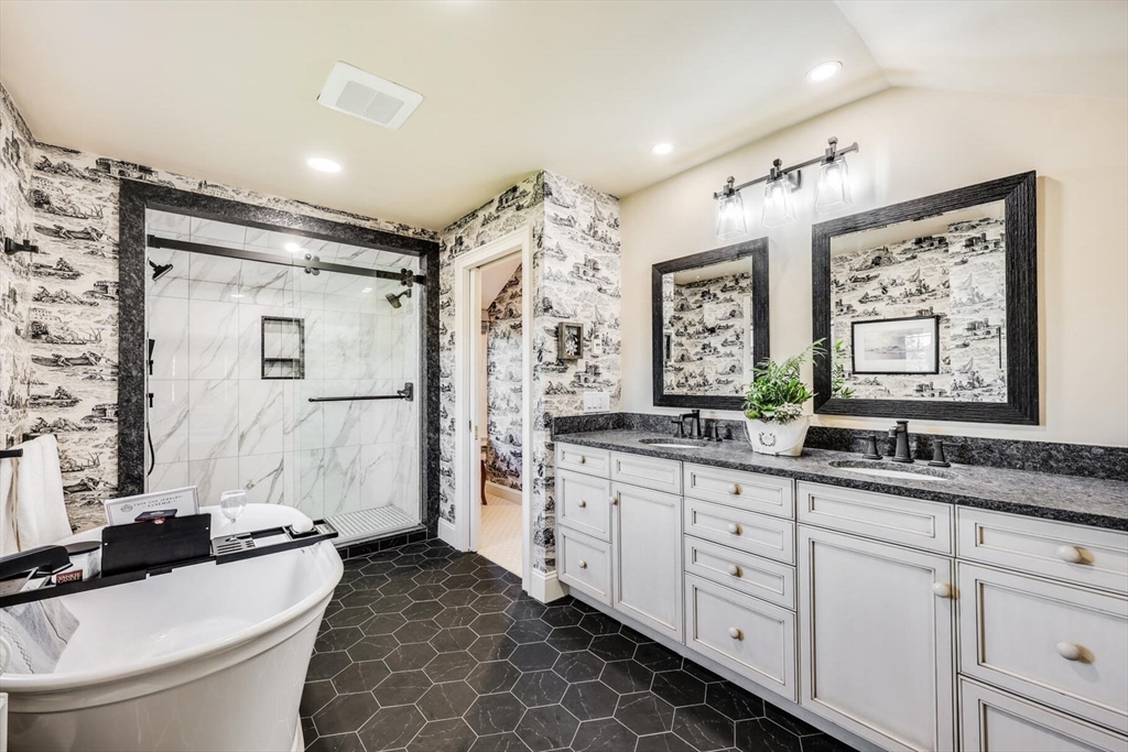 55 Cove Road Eastham, MA 02642 - Photo 34 of 42 a bathroom with a double vanity sink toilet mirror and shower