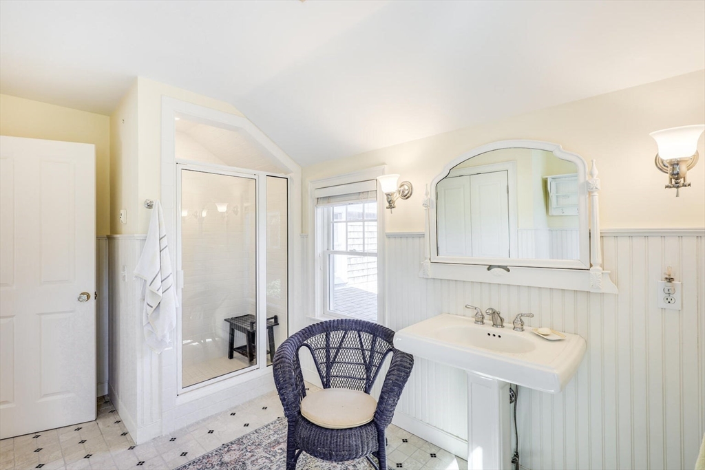 55 Cove Road Eastham, MA 02642 - Photo 37 of 42 a bathroom with a sink a toilet and a mirror