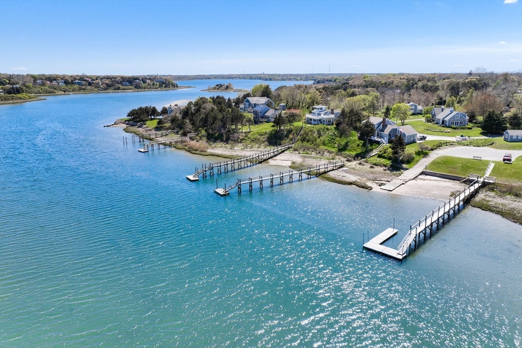 55 Cove Road Eastham, MA 02642 - Photo 4 of 42 an aerial view of a garden with an outdoor seating
