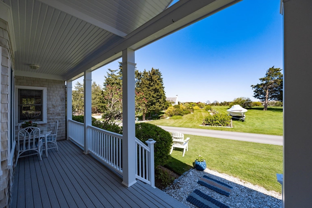 55 Cove Road Eastham, MA 02642 - Photo 9 of 42 a view of a balcony with lake view and a ocean view