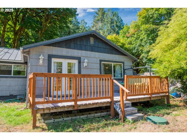 a view of backyard with a deck