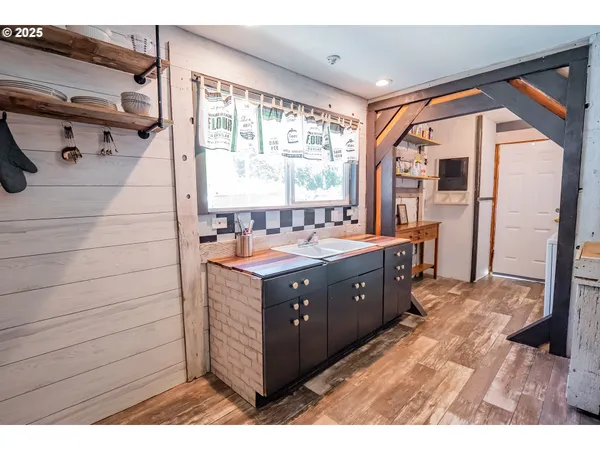 a bathroom with a double vanity sink a mirror and a shower