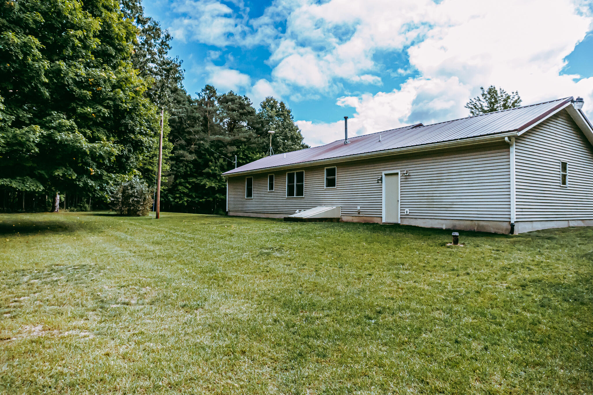 6545 18 Mile Road Northeast Cedar Springs, MI 49319 - Photo 22 of 33 18 mile side byard
