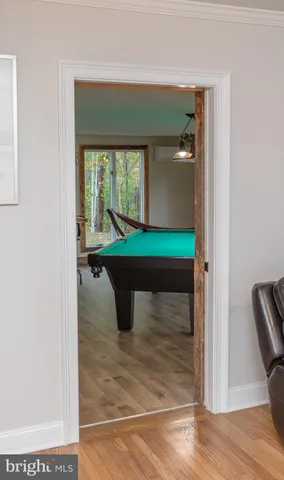a room that has a window and a wooden floor