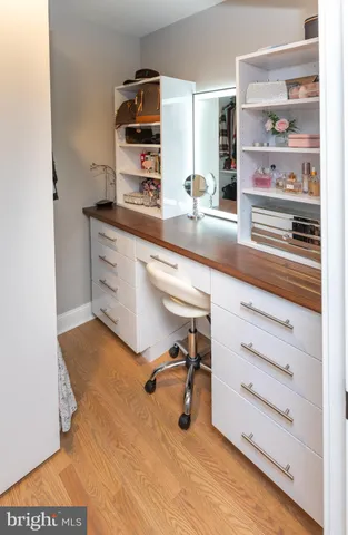 a kitchen with kitchen island a oven a sink and cabinets
