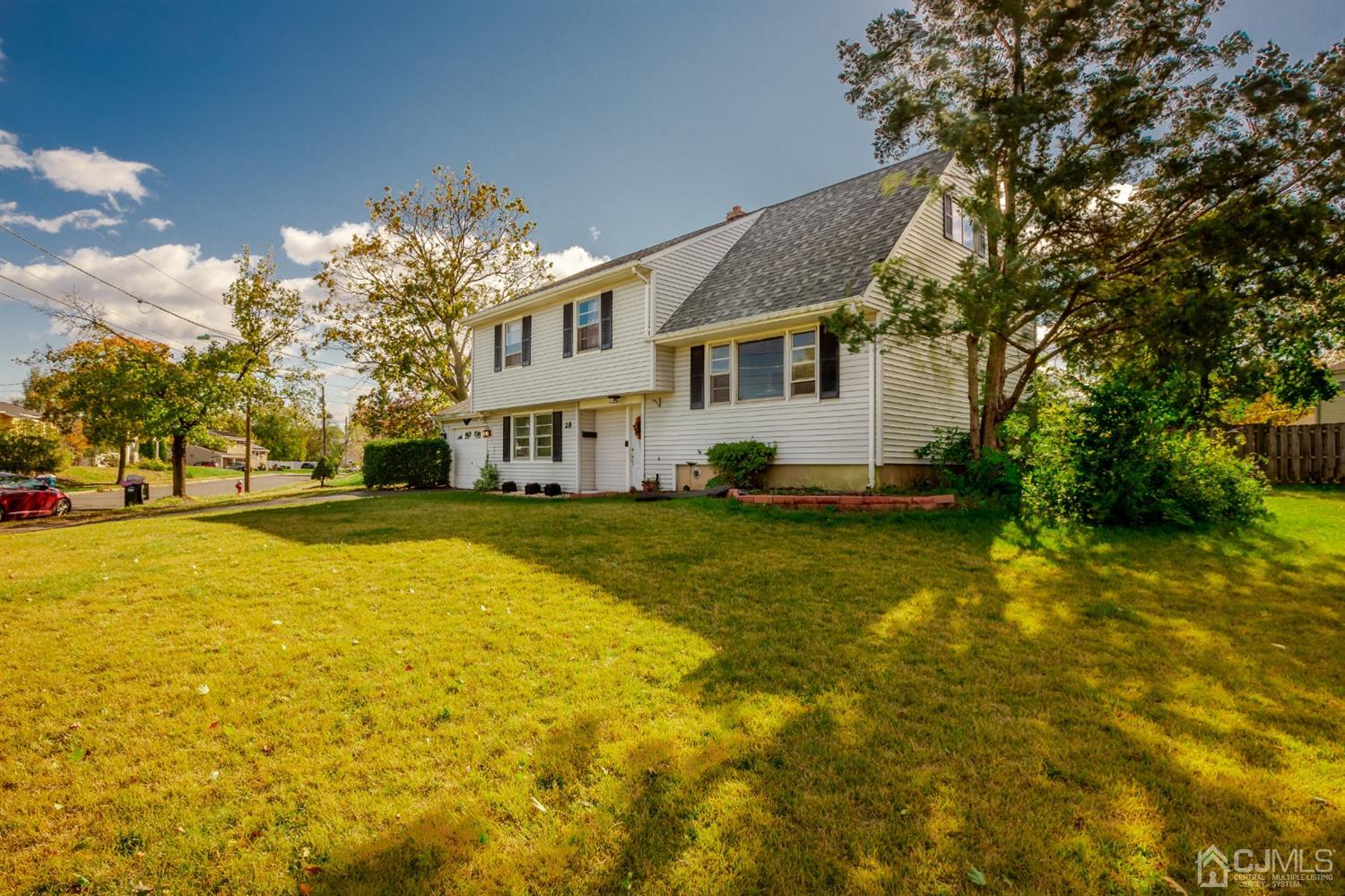 28 Atlantic Road Somerset, NJ 08873 - Photo 2 of 18 a view of a house with a yard and tree s