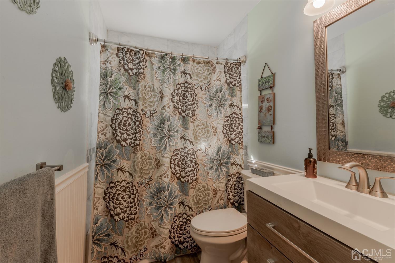 28 Atlantic Road Somerset, NJ 08873 - Photo 14 of 18 a bathroom with a sink toilet and shower