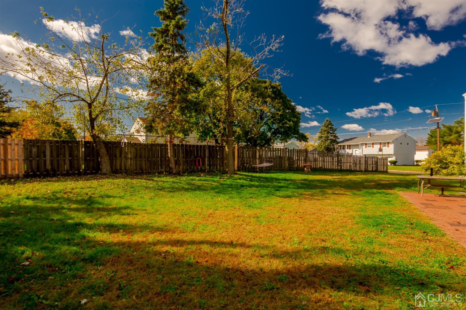 28 Atlantic Road Somerset, NJ 08873 - Photo 17 of 18 a swimming pool with outdoor seating and yard
