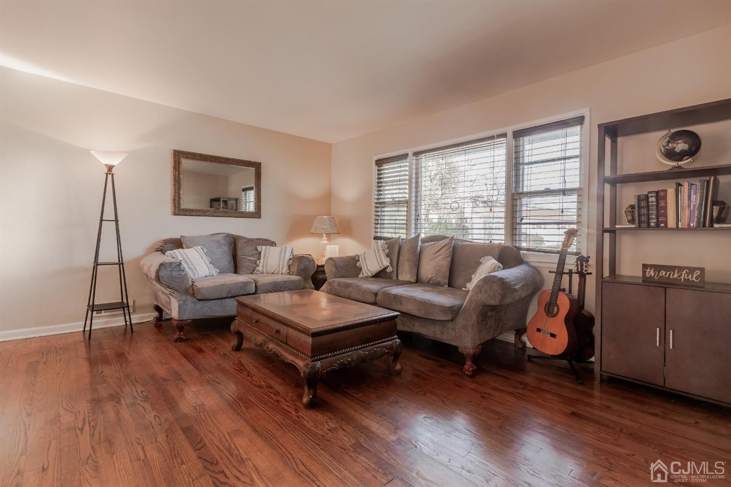 28 Atlantic Road Somerset, NJ 08873 - Photo 5 of 18 a living room with furniture and a wooden floor