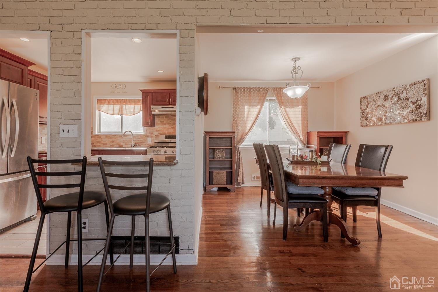 28 Atlantic Road Somerset, NJ 08873 - Photo 7 of 18 a view of a dining room with furniture and wooden floor
