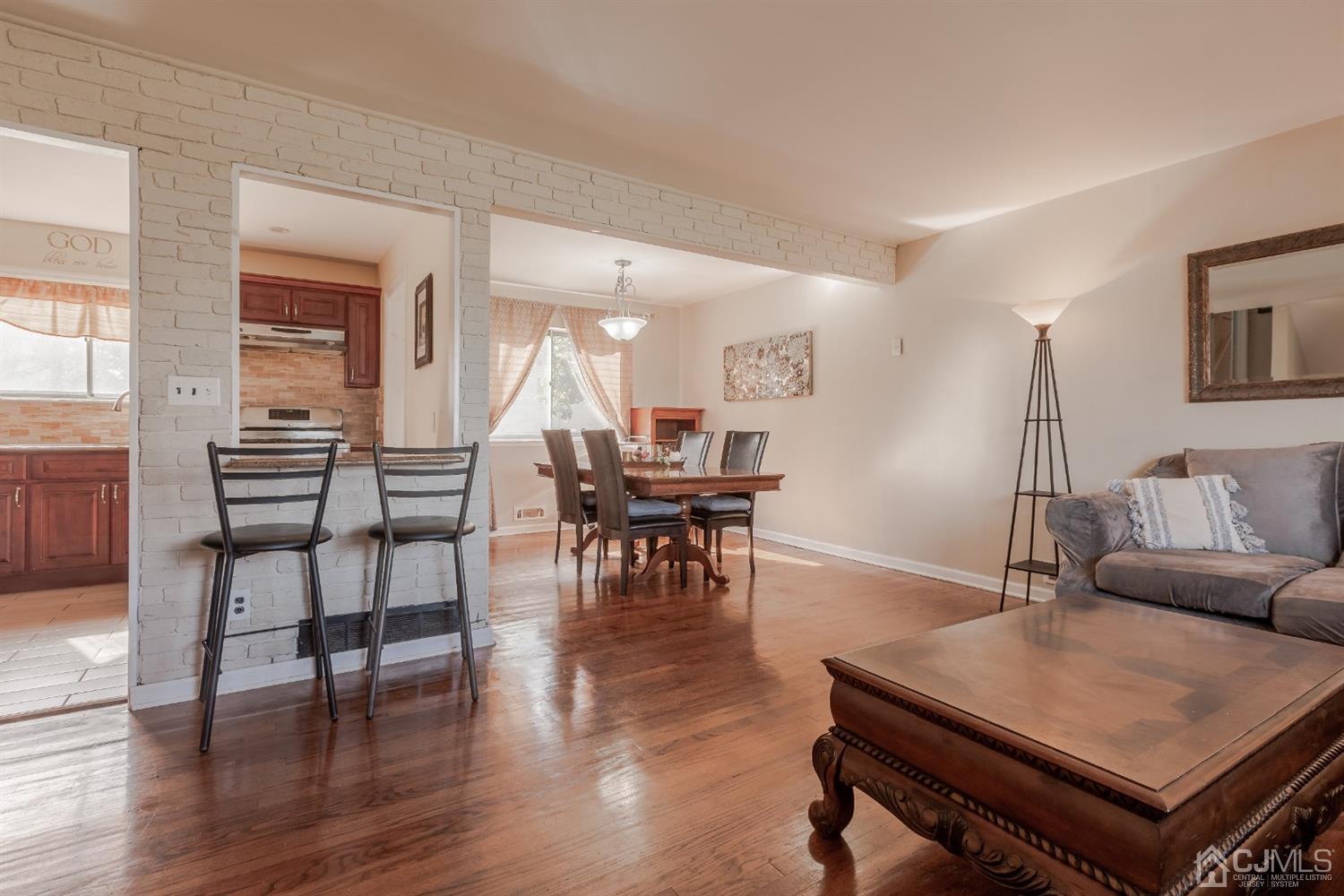 28 Atlantic Road Somerset, NJ 08873 - Photo 8 of 18 a living room with furniture and wooden floor