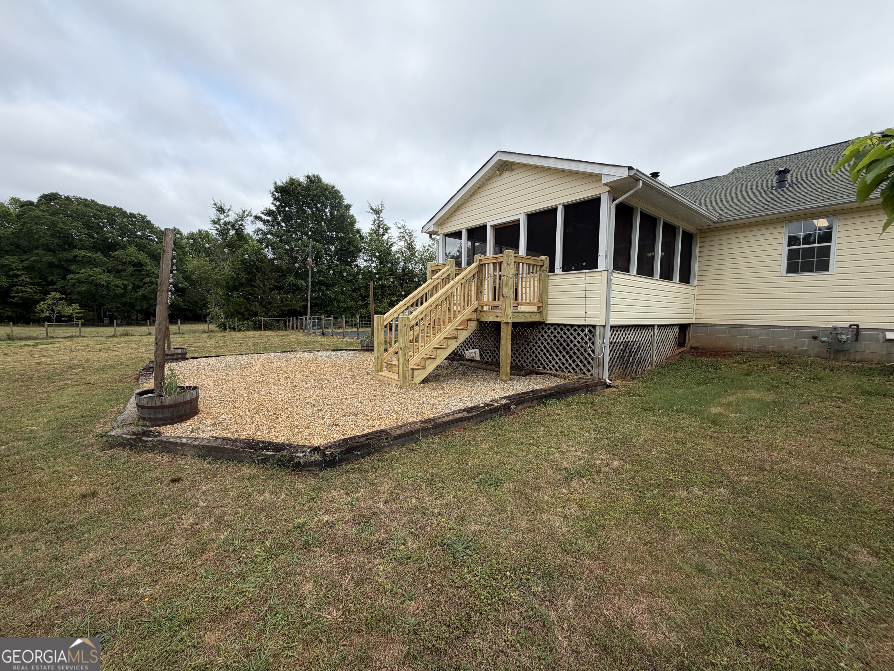 1410 Greensboro Road Madison, GA 30650 - Photo 5 of 17 a view of a house with backyard and sitting area