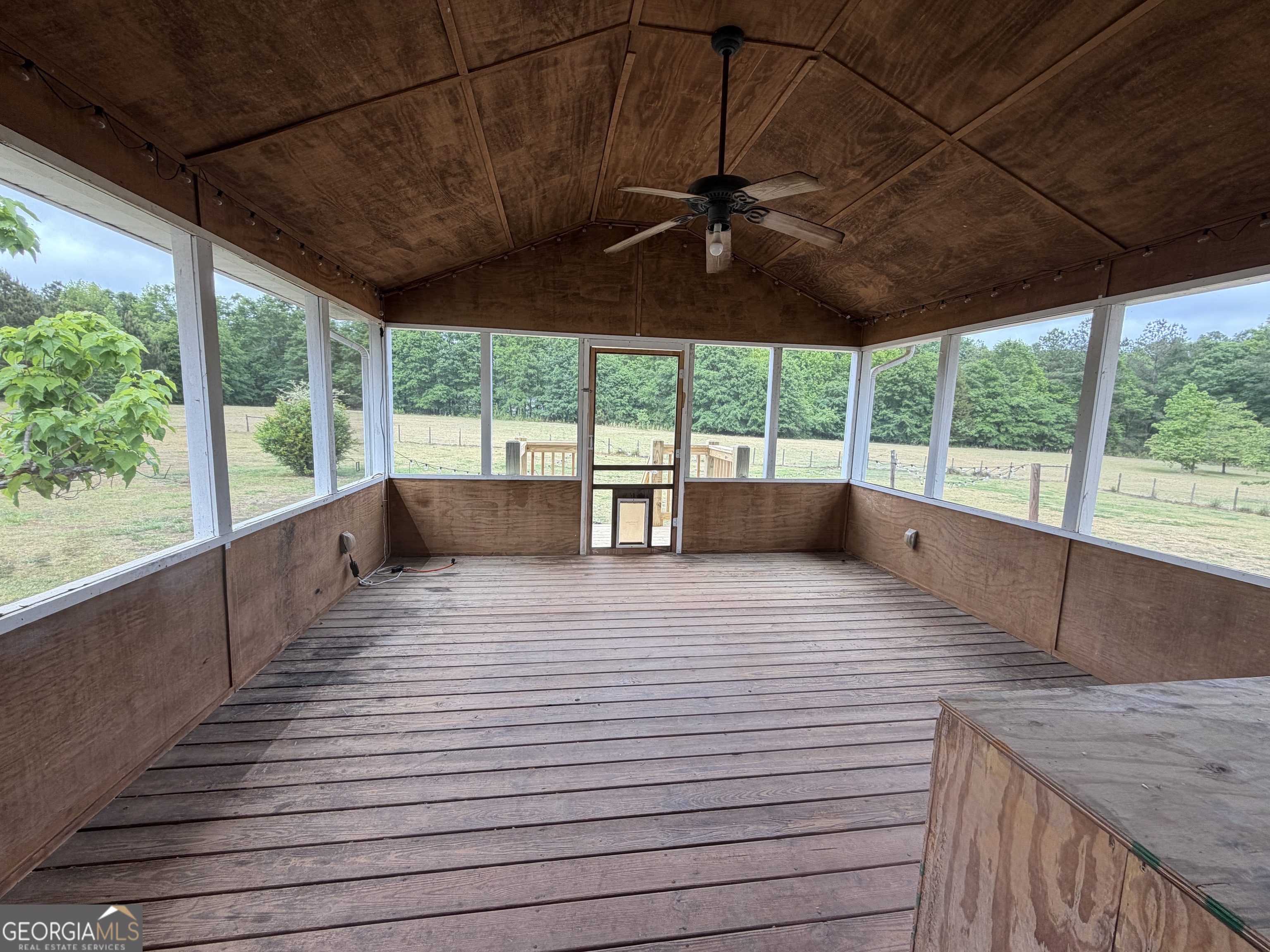1410 Greensboro Road Madison, GA 30650 - Photo 7 of 17 a view of a deck area with wooden floor and outdoor space