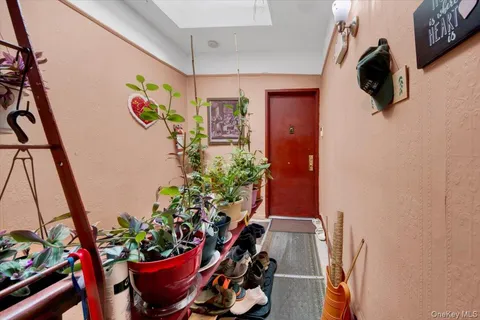 a room with flowers in it and a window