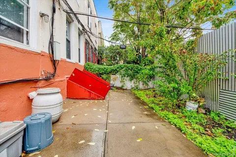 a picture of a bench in front of a wall