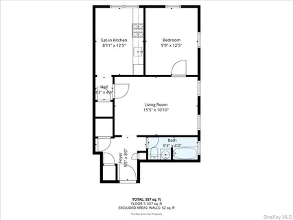 a picture of a bench in front of a wall