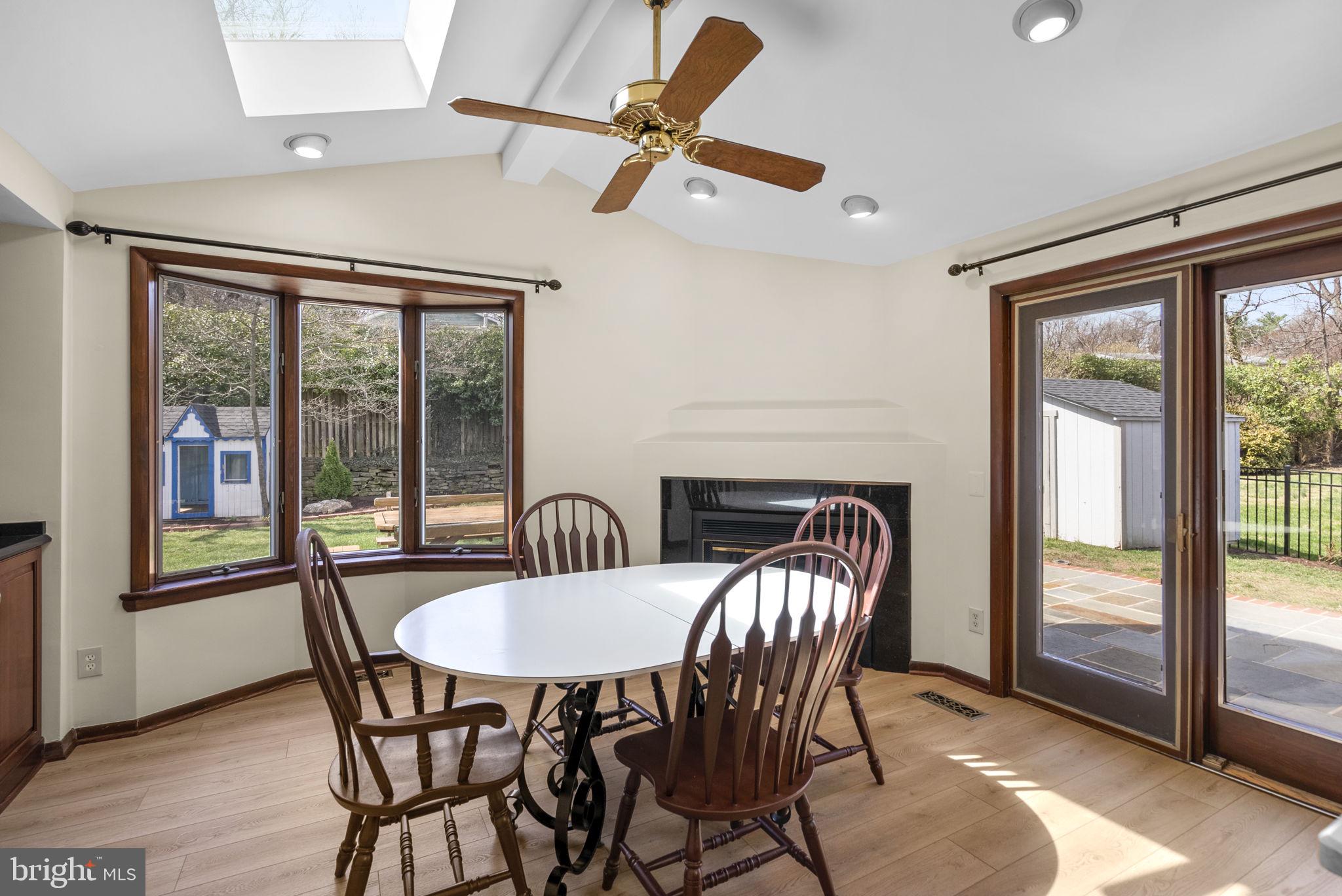 5108 Viking Road Bethesda, MD 20814 - Photo 18 of 51 a dining room with furniture large windows and a chandelier