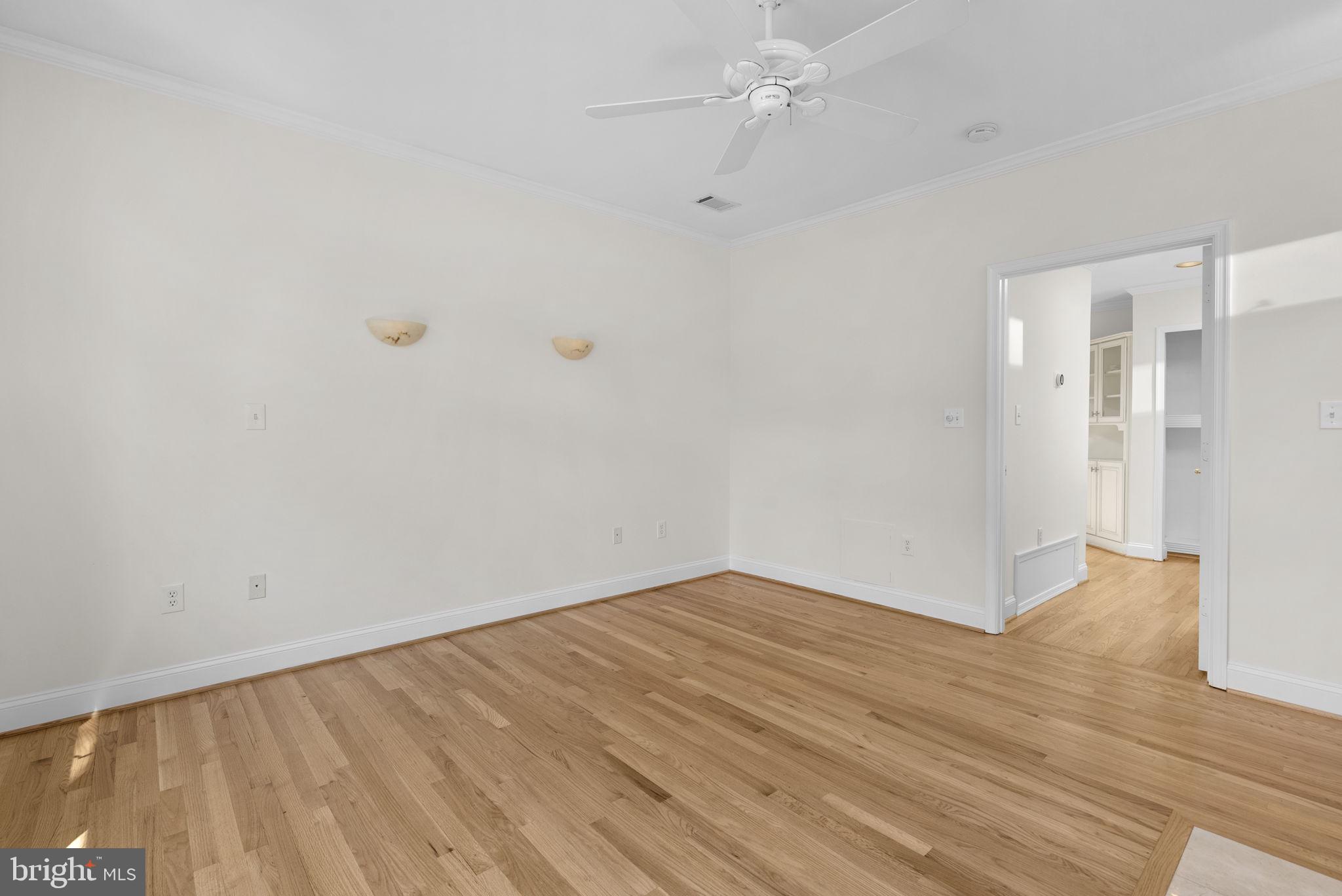 5108 Viking Road Bethesda, MD 20814 - Photo 23 of 51 a view of an empty room with wooden floor and a ceiling fan