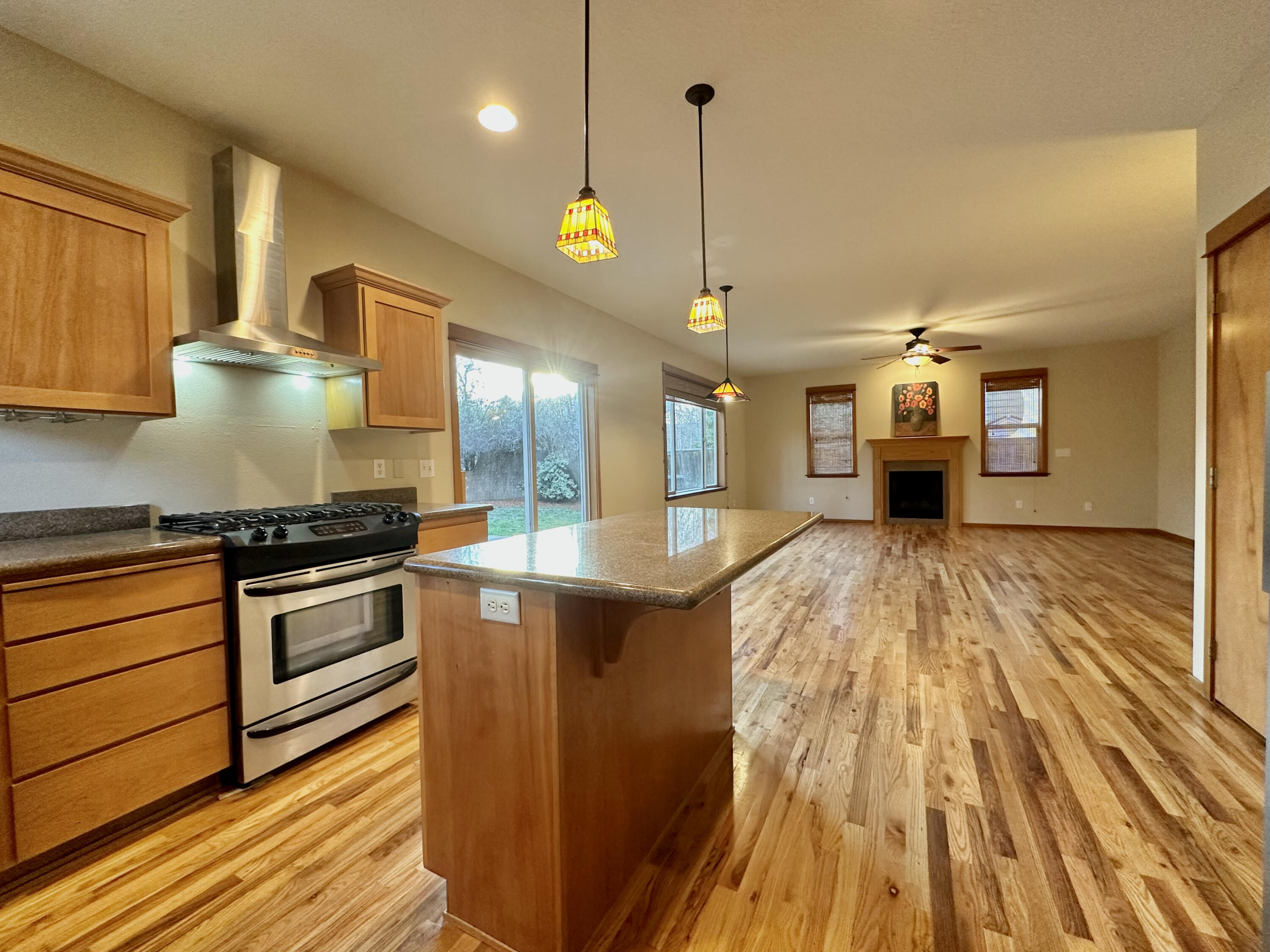 133 Max Loop Talent, OR 97540 - Photo 6 of 55 a kitchen with stainless steel appliances granite countertop a sink a stove and a wooden floors
