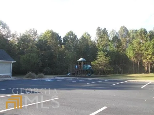 a view of a yard and an trees