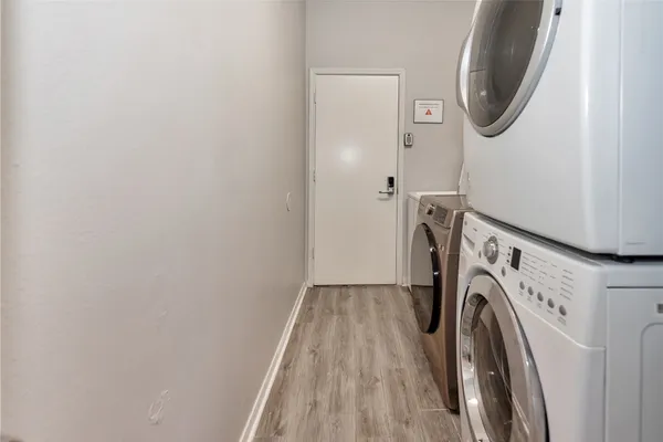a view of a storage and utility room with washer and dryer
