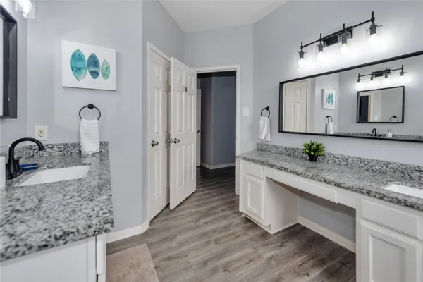 a bathroom with sink and mirror
