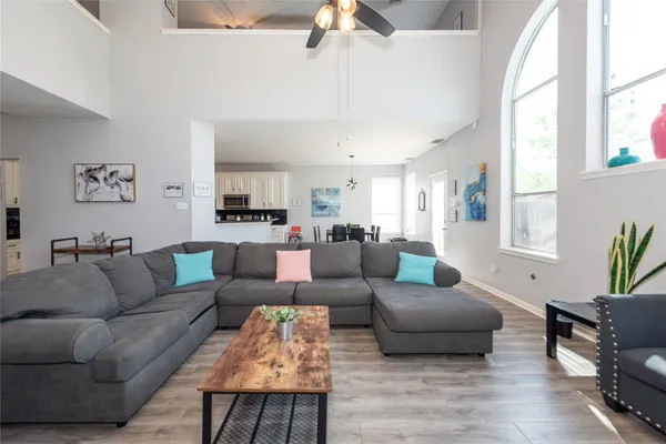 a living room with furniture and a large window