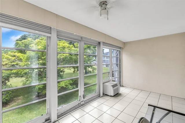 a view of empty room with windows