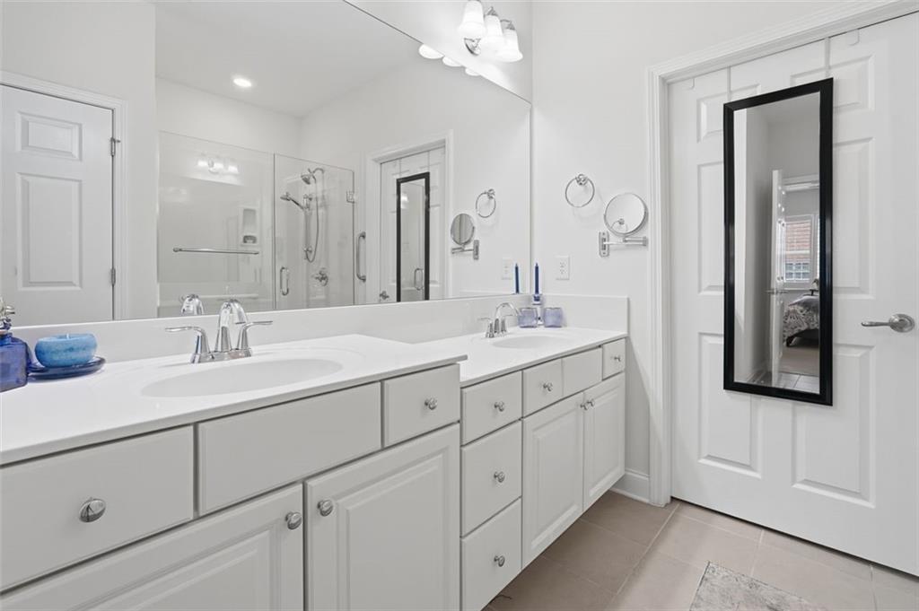 3328 Ivy Ridge Court Buford, GA 30519 - Photo 28 of 34 a bathroom with double sink and a mirror