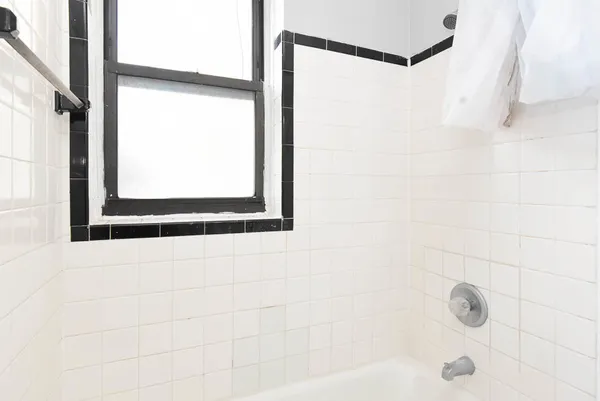 a bathroom with a shower and a bathtub