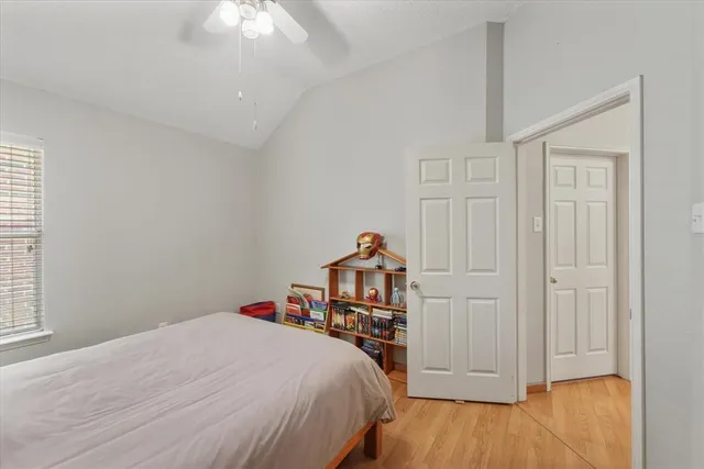 a bed room with a bed and a chandelier